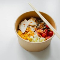 take away food in brown paper craft plate and wooden sticks. chicken, corn, tomatoes, celery and sause. take away delivery. environment protection - junk food stock pictures, royalty-free photos & images