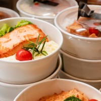 take away food in compostable containers stacked on top of each other in display fridge - junk food stock pictures, royalty-free photos & images