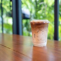 take away iced coffee on table - junk food stock pictures, royalty-free photos & images
