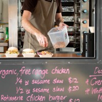 takeaway food being prepared on biodegradable plates in a food truck - junk food stock pictures, royalty-free photos & images