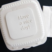 Takeout container of vegetable combo platter of beets, collard greens, tomato salad and lentils delivery from Rohobot, Silver Spring, Maryland on...