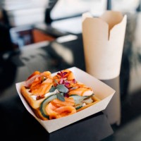 takeout treat: savory smoked salmon waffles and stir-fried noodles in paper containers - junk food stock pictures, royalty-free photos & images