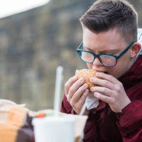 taking a bite - junk food stock pictures, royalty-free photos & images