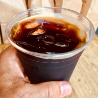 taking my ice cold coffee brew from the coffee counter - junk food stock pictures, royalty-free photos & images