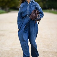Tamara Kalinic is seen wearing a denim Loewe shirt and pants with burgundy bag and gold sunglasses outside the Loewe show during Womenswear...