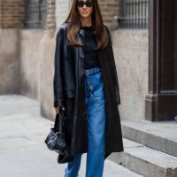 Tamara Kalinic wears black coat, denim jeans, shirt, sandals, bag outside Proenza Schouler on February 10, 2024 in New York City.