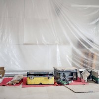 tarps covering living room surfaces undergoing renovation - home decoration stock pictures, royalty-free photos & images