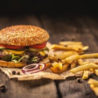 tasty hamburger with french fries on wooden table - junk food stock pictures, royalty-free photos & images