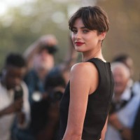 Taylor Hill is seen outside Mugler show wearing black cropped tank top and silver earrings and necklace during the Womenswear Spring/Summer 2024 as...