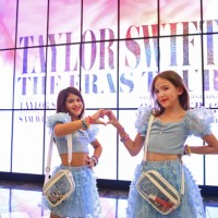 Taylor Swift fans, aka Swifties, are dressed as Taylor Swift and wear Taylor Swift concert tee shirts at The World Premiere of 