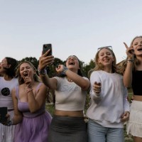 Taylor Swift's fans are singing and dancing holding their mobile phones outside the National Stadium during the Eras Tour. American singer Taylor...