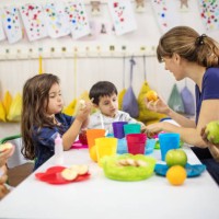 teacher explaining fruits to students in classroom - food stock pictures, royalty-free photos & images