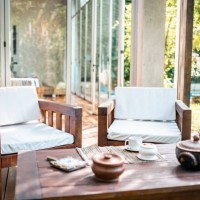 teak outdoor furniture on deck of modern home - home decoration stock pictures, royalty-free photos & images