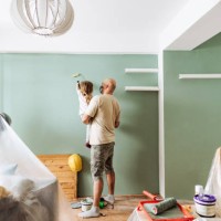 teamwork in house renovation - daddy and daughter painting together - home decoration stock pictures, royalty-free photos & images