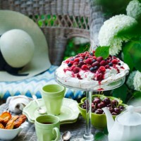 teatime in summer garden. meringue cake with berries or pavlova dessert - garden decoration stock pictures, royalty-free photos & images