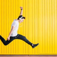teen with headphones and smartphon listening to music jumping - fashion stock pictures, royalty-free photos & images
