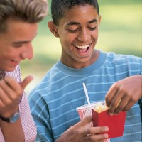teenage boys with fast food - junk food stock pictures, royalty-free photos & images