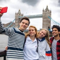 teenage friends visiting london on tower bridge - travel stock pictures, royalty-free photos & images