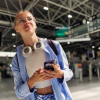 teenage girl at the airport and using smartphone - travel stock pictures, royalty-free photos & images