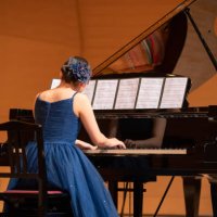 teenage girl playing piano at concert hall - concert stock pictures, royalty-free photos & images