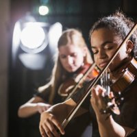teenage girls playing violin in concert - concert stock pictures, royalty-free photos & images