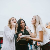 teenage women friend group enjoying state fair - food stock pictures, royalty-free photos & images