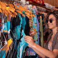 teenager choosing bikini in store - fashion stock pictures, royalty-free photos & images