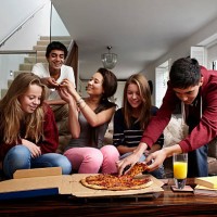 teenagers having take away pizza - junk food stock pictures, royalty-free photos & images