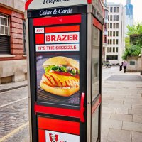 telephone booth with fast food advertising, london - junk food stock pictures, royalty-free photos & images