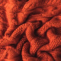 texture of a knitted red brown sweater with pleats. flat style, close-up. - home decoration stock pictures, royalty-free photos & images