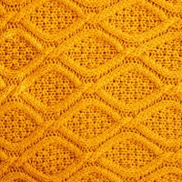 texture of warm knitted sweater. backdrop in yellow color. - home decoration stock pictures, royalty-free photos & images