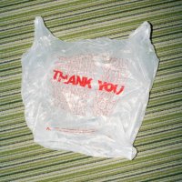 thank you in red letters on plastic bag on striped carpet - junk food stock pictures, royalty-free photos & images