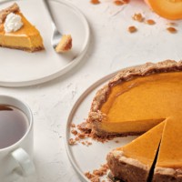 thanksgiving traditional pumpkin pie on a white table with napkins, pumpkin, plates and cutlery. food photography for thanksgiving. - home decoration stock pictures, royalty-free photos & images