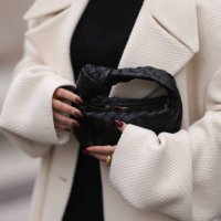 Thanya Wong seen wearing Polène Paris gold jewelry / rings, Vautrait cream white oversized wool short coat / jacket, COS black high neck top and...