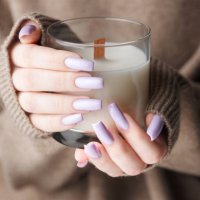 the hands of a young girl with a beautiful light purple manicure hold a candle,ukraine - nails art stock pictures, royalty-free photos & images