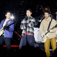 The Jonas Brothers perform during a pre-game concert prior to the 2024 Navy Federal Credit Union Stadium Series at MetLife Stadium on February 17,...