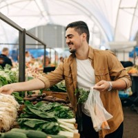 the man behind the vegetable stand. - food stock pictures, royalty-free photos & images