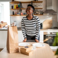 the young couple sets the table for lunch - junk food stock pictures, royalty-free photos & images