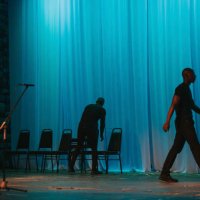 theatre crew arranging chairs on stage set getting ready for stage performance - concert stock pictures, royalty-free photos & images