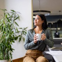 thoughtful businesswoman taking a break and drinking a cup of coffee - coffee stock pictures, royalty-free photos & images