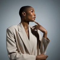 thoughtful, stylish young woman in white blazer - fashion stock pictures, royalty-free photos & images