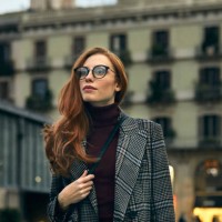 thoughtful woman wearing long coat walking in city - fashion stock pictures, royalty-free photos & images
