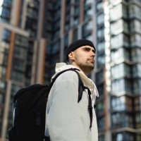 thoughtful young man in the new neighborhood - fashion stock pictures, royalty-free photos & images