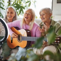 three beautiful senior musicians using social media to share their music. - concert stock pictures, royalty-free photos & images