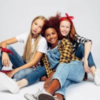three beautiful young girls sitting at the studio - fashion stock pictures, royalty-free photos & images