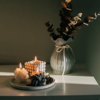 three burning candles on tray in darkroom. babble candle - home decoration stock pictures, royalty-free photos & images