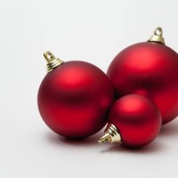 three christmas baubles on white background - home decoration stock pictures, royalty-free photos & images