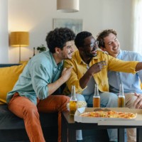 three friends having fun taking a selfie during a casual gathering at home - junk food stock pictures, royalty-free photos & images