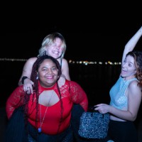 three friends having fun together at night on the beach - concert stock pictures, royalty-free photos & images