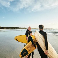 three generations of surfers on beach - travel stock pictures, royalty-free photos & images